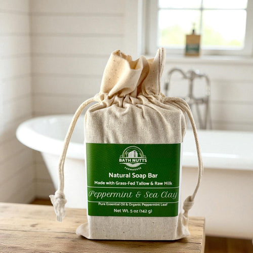 Bath Nutts natural peppermint & sea clay soap bar in a cloth bag on a bathroom counter
