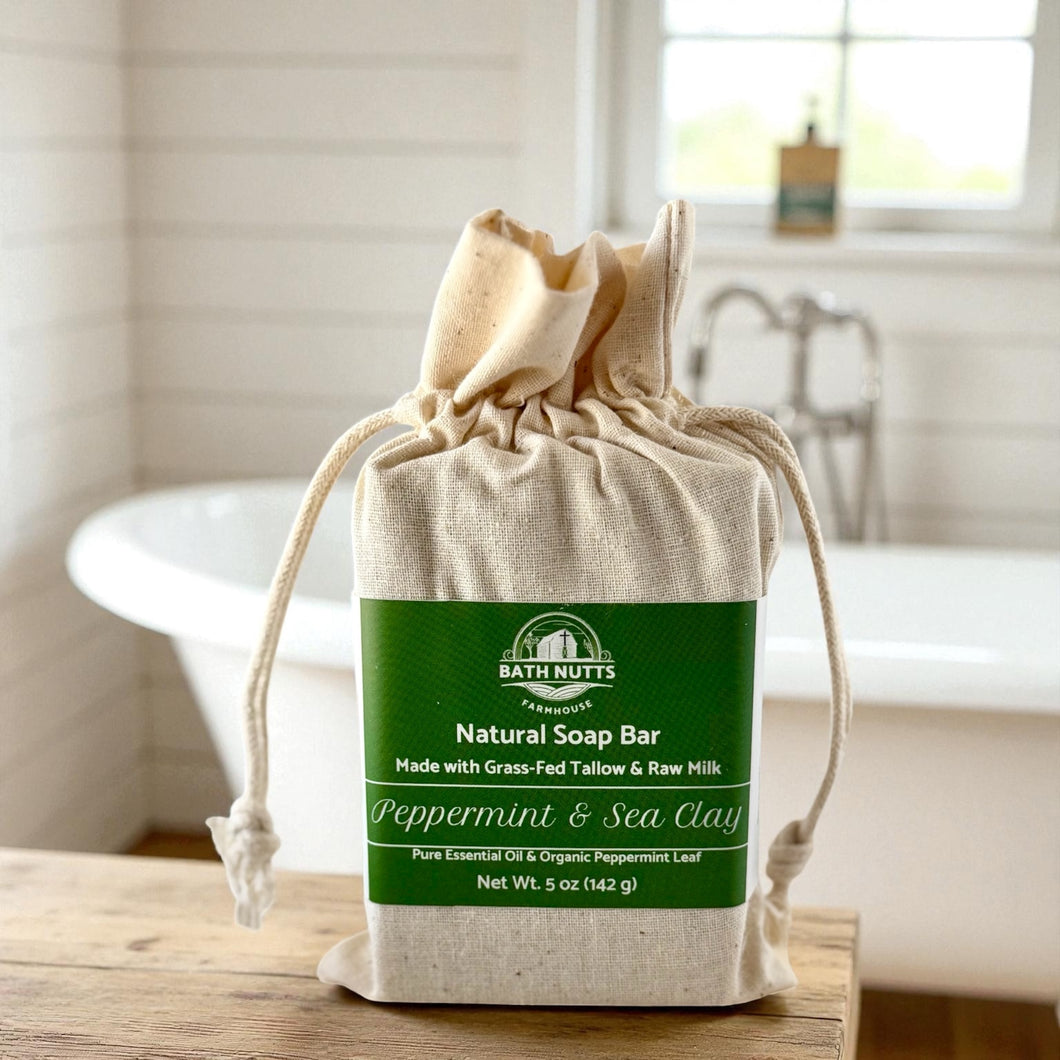 Bath Nutts natural peppermint & sea clay soap bar in a cloth bag on a bathroom counter