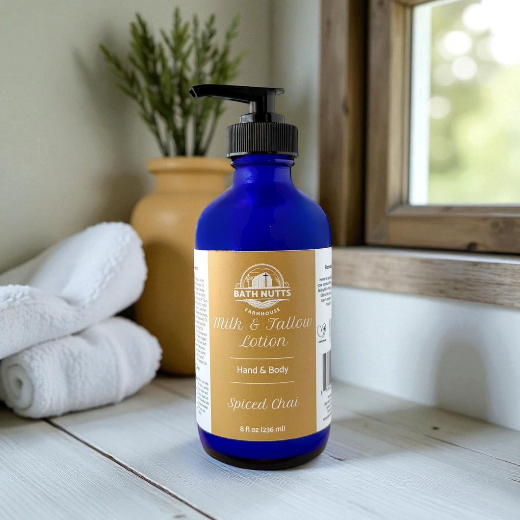 Bath Nutts Spiced Chai lotion in blue bottle on wooden surface with blurred background 