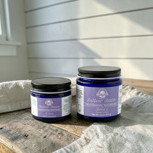 Load image into Gallery viewer, Two jars of Bath Nutts Farmhouse Tallow Balm on a wooden surface with a white wall background.