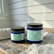 Load image into Gallery viewer, Two jars of Bath Nutts Farmhouse Vanilla Mint Tallow balm on a wooden surface with a white wall background